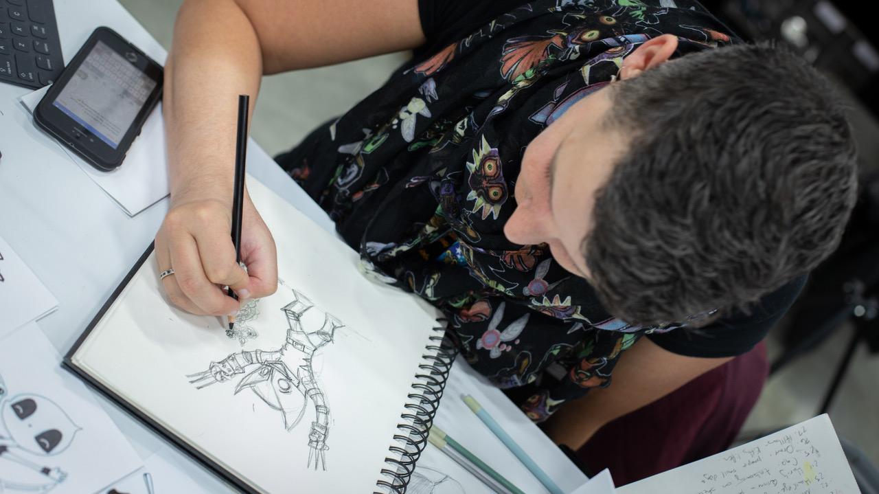 An artist drawing at the Calgary Expo