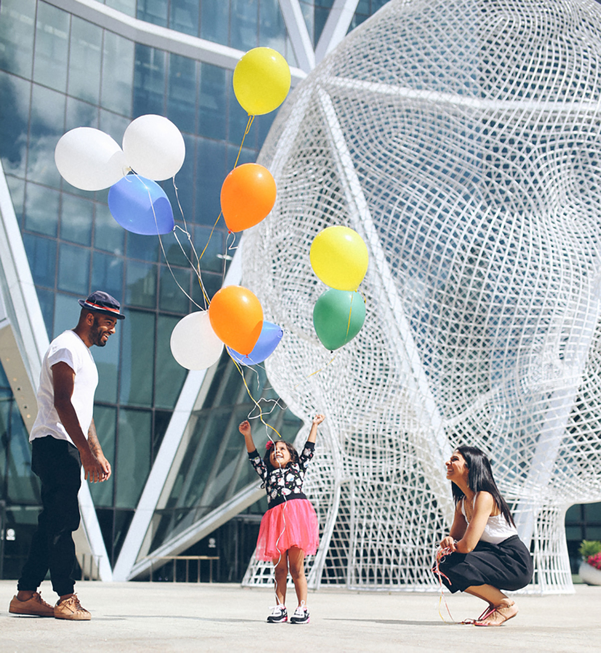 A family visits the Wonderland sculpture downtown Calgary